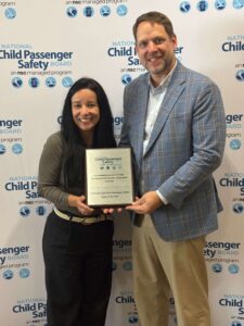 Paula Bell and Stewart Williams picked up the recognition plaque for 2026 Team of the Year Dell Children's Injury Prevention at the Lifesavers Conference on Roadway Safety in Baltimore, Md.