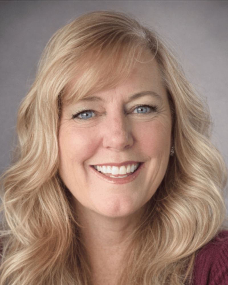 This is a head-and-shoulders photograph of National Child Passenger Safety Board member Jennifer Booge. She is smiling and looking straight into the camera.